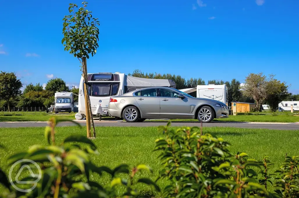 Electric hardstanding pitches with parking space available