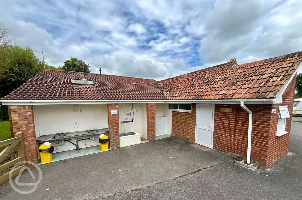 Outdoor washing up area and dog wash by the facilities block