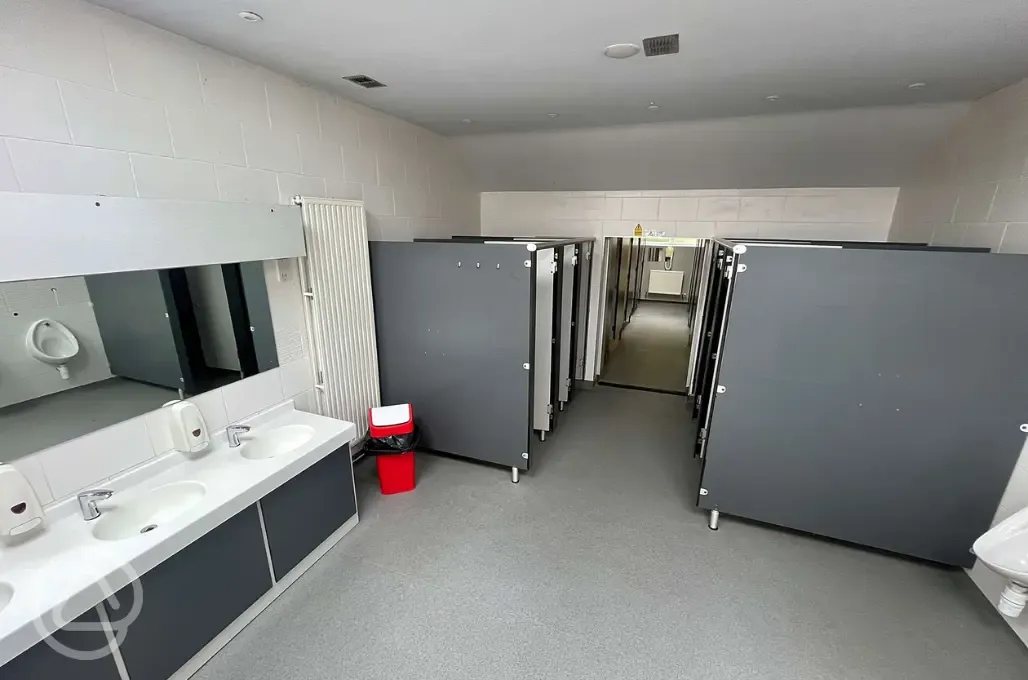 Male toilets and showers with hooks and urinals