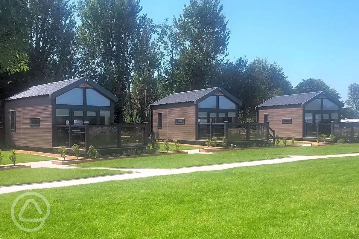 Studio pod cabins with private decking and outdoor furniture