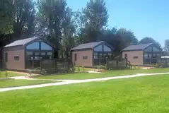 Studio pod cabins with private decking and outdoor furniture Studio pod cabins with private decking and outdoor furniture