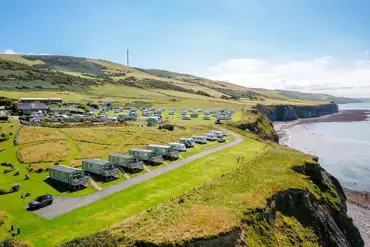 Aerial of grass pitches overlooking the cliff at Morfa Bychan 