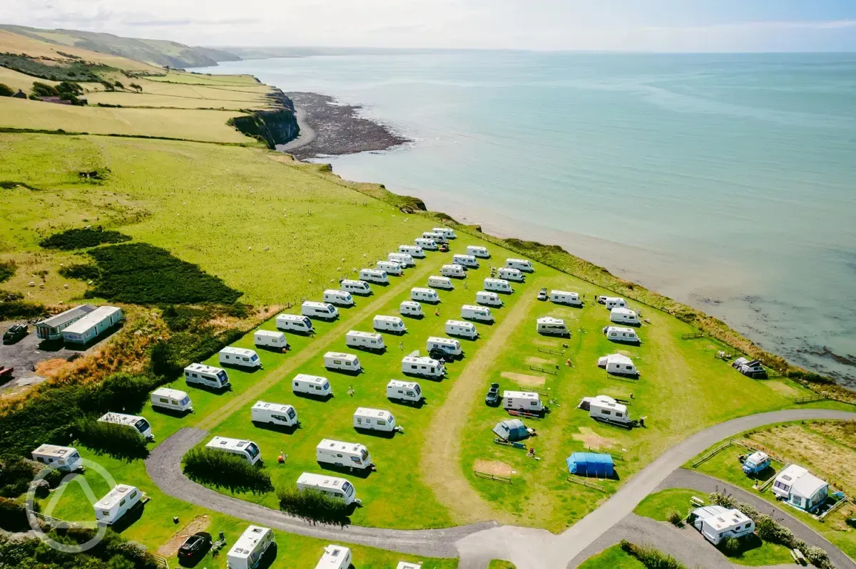 Aerial of grass touring pitches at Morfa Bychan overlooking Cardigan Bay