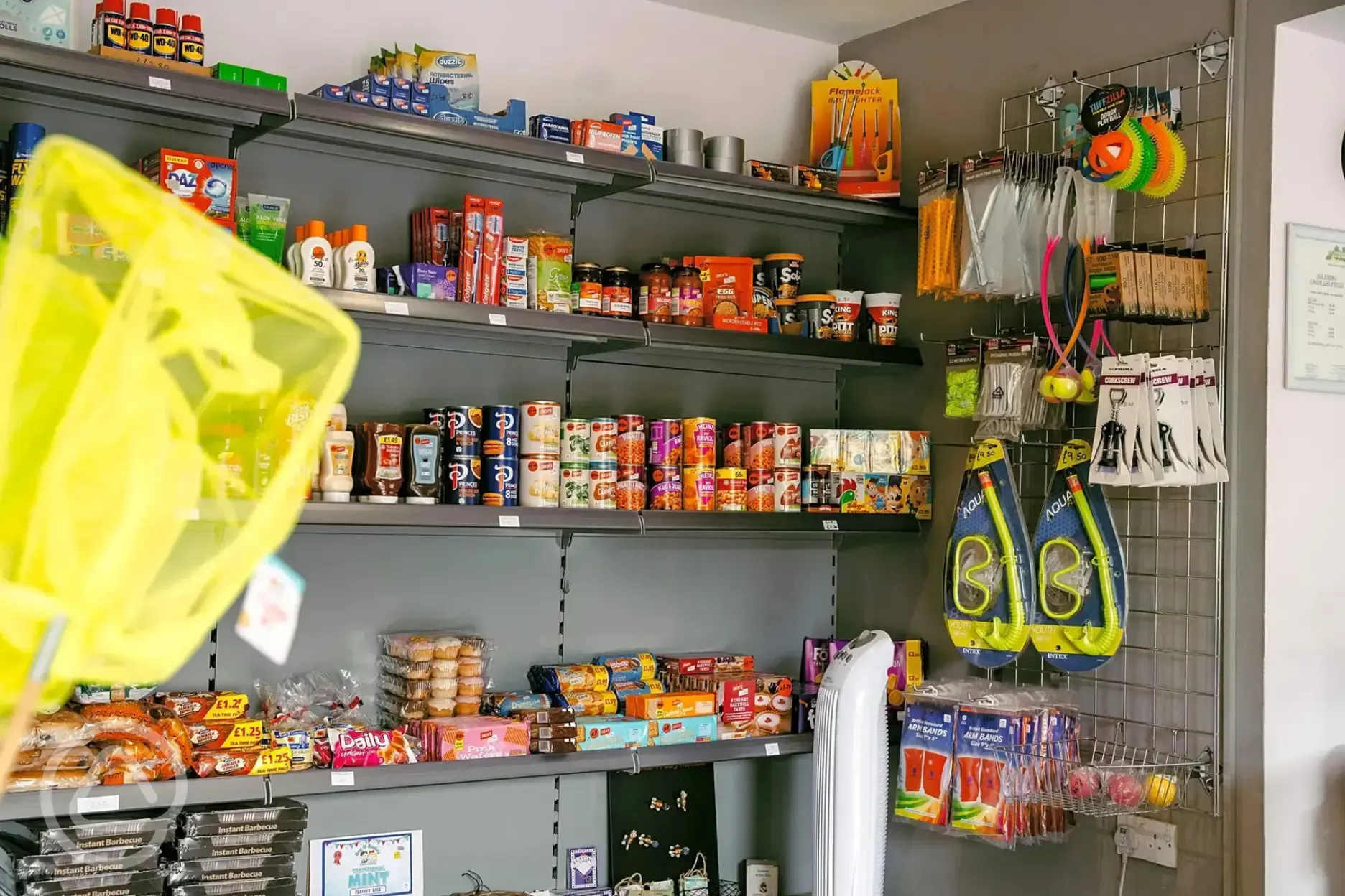Onsite shop with a selection of tinned food, snacks, and toys
