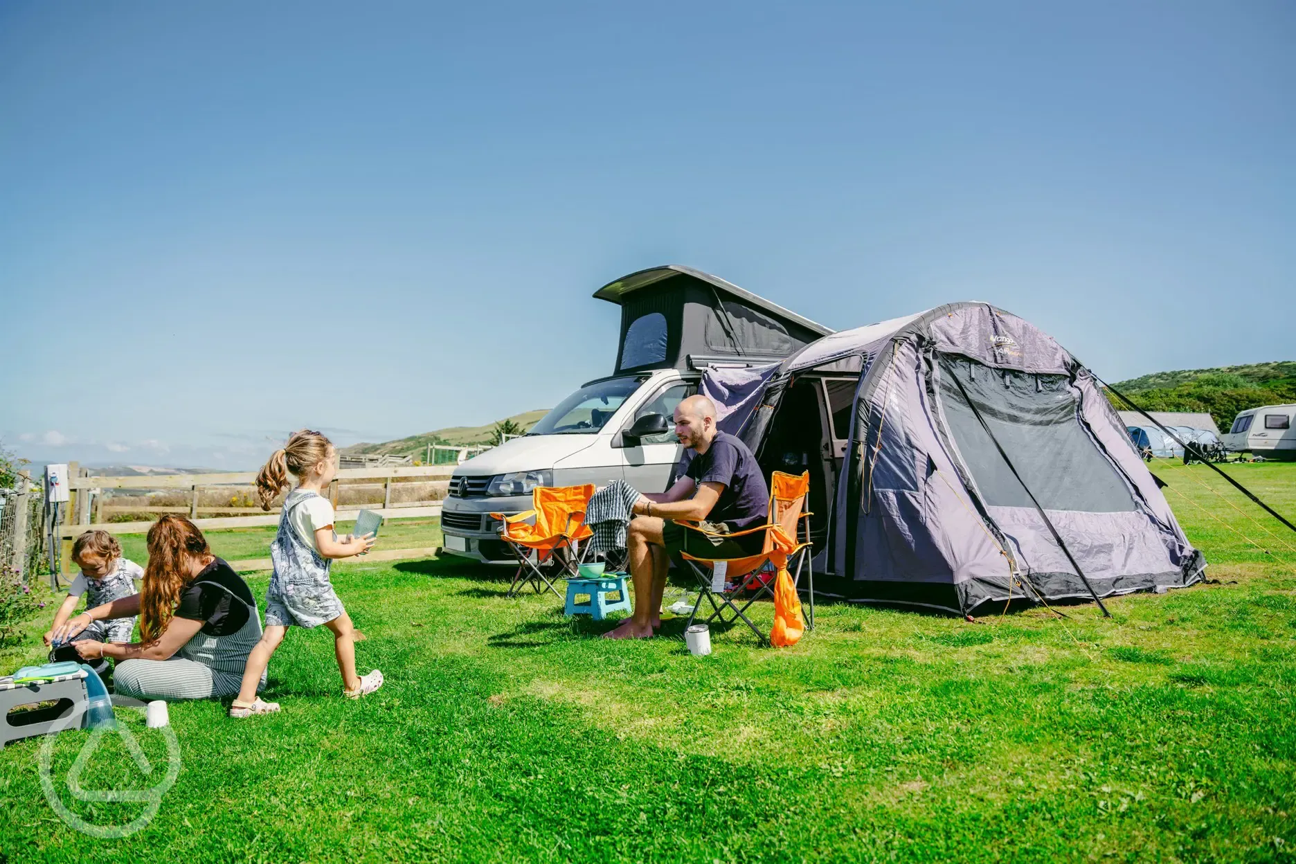 Tourer on tent pitch with an awning beside at Morfa Bychan 