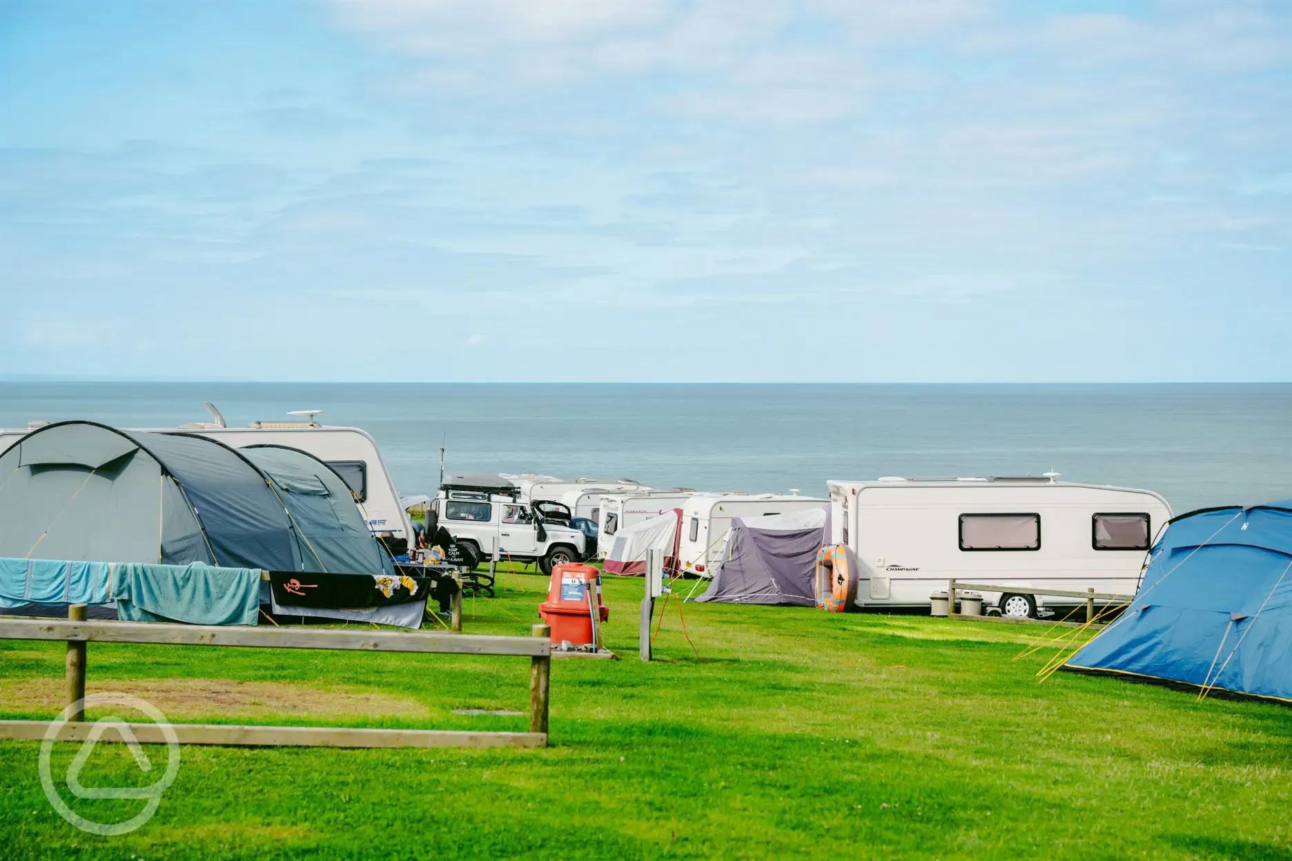 Grass pitches for campers and tourers with sea views