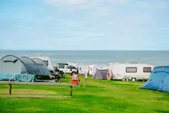 Grass pitches for campers and tourers with sea views