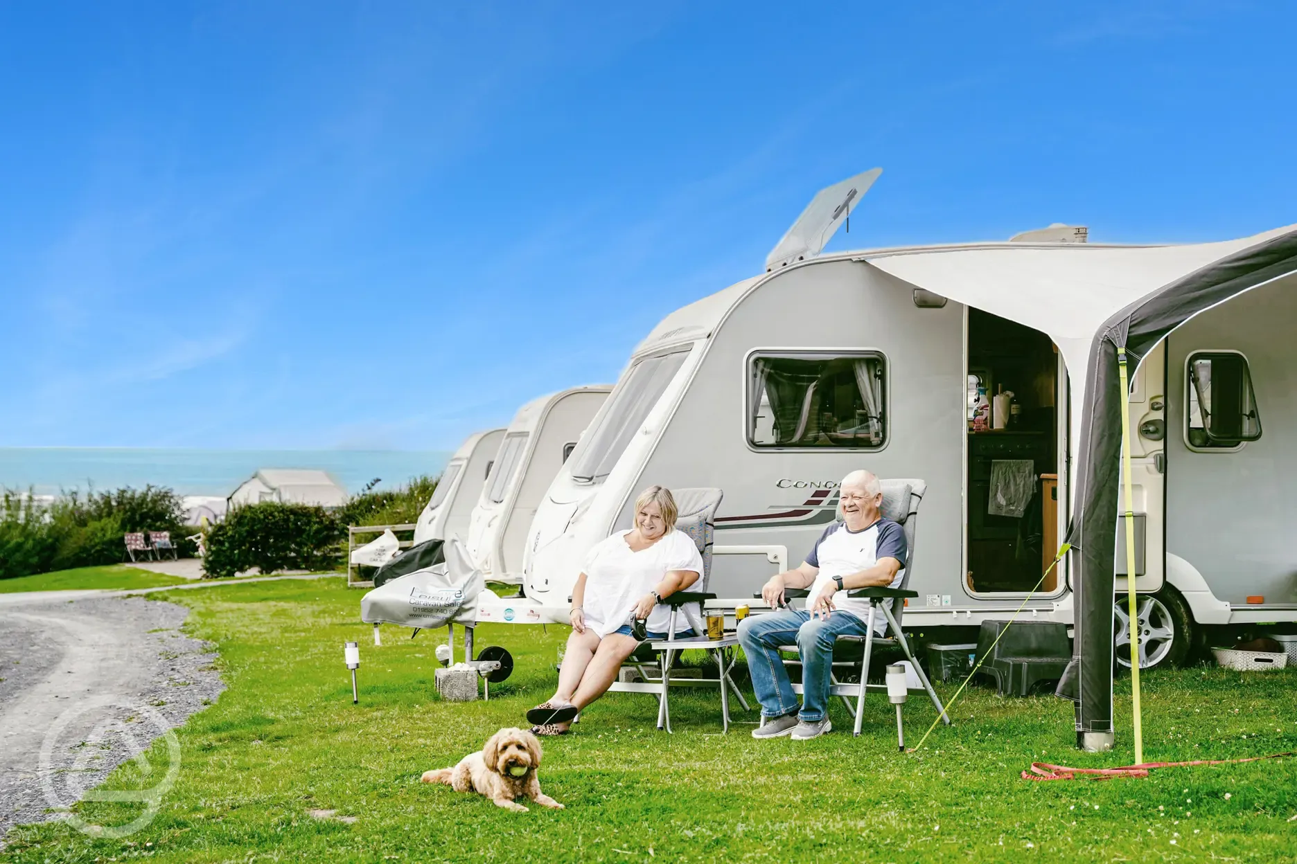 Tourers on grass pitches at Morfa Bychan (dog friendly)