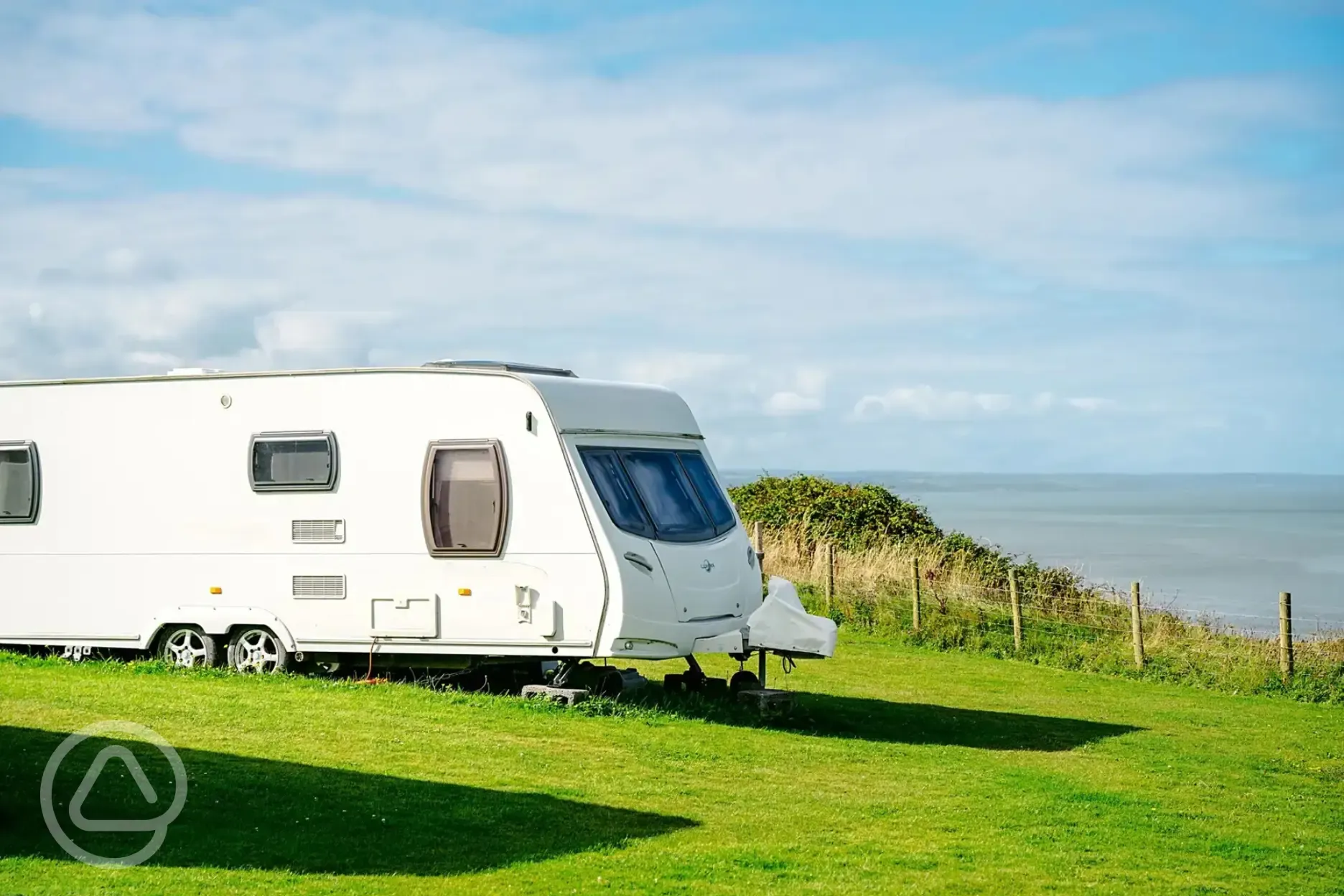 Twin axel on grass pitch with sea views