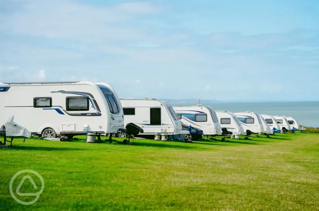 Tourers on grass pitches at Morfa Bychan with sea views 
