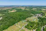 Aerial of Norden Farm overlooking the fishing pond and pitches