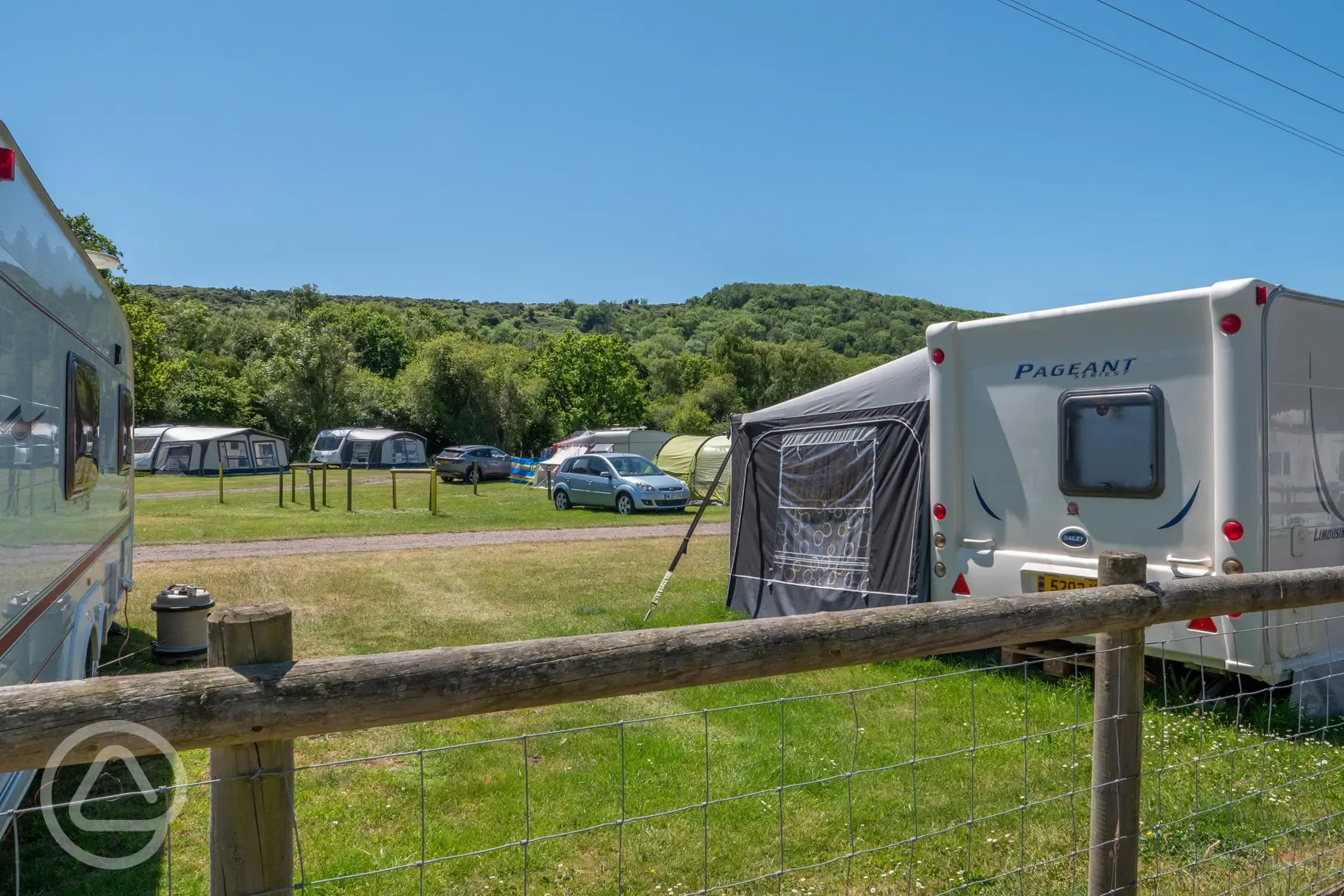 Grass pitches with woodland view