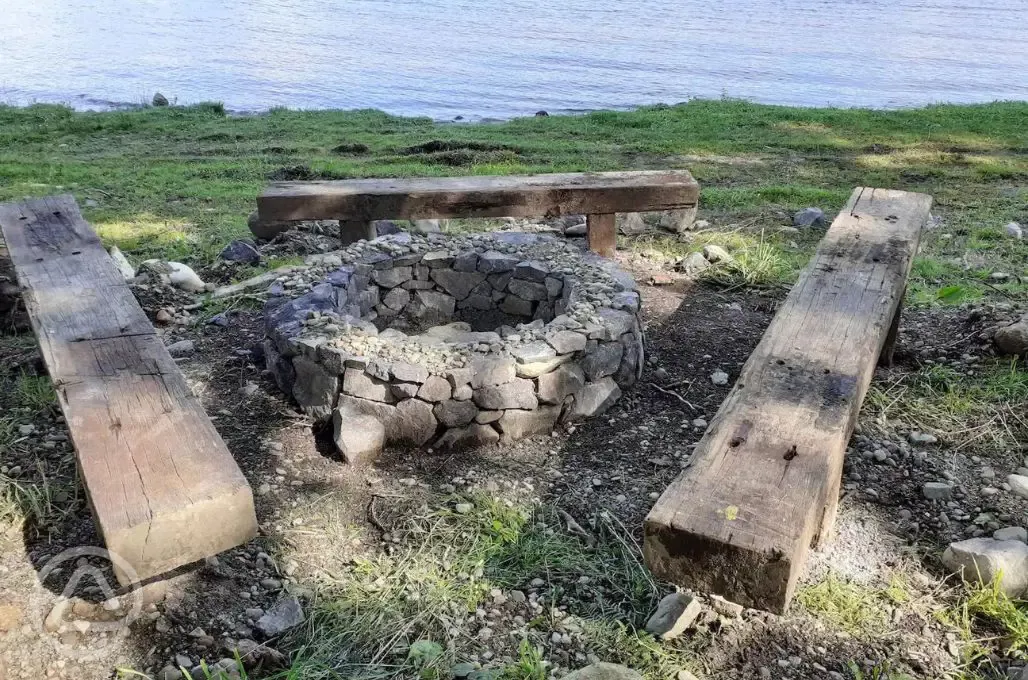 Communal fire pit by the loch