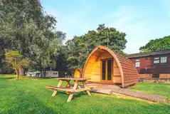 Camping pod with a decked outdoor area
