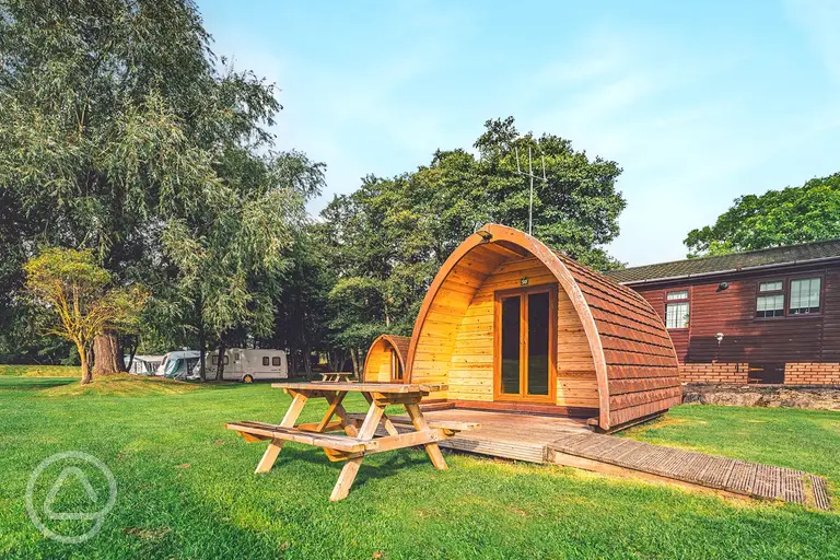 Camping pod with a decked outdoor area