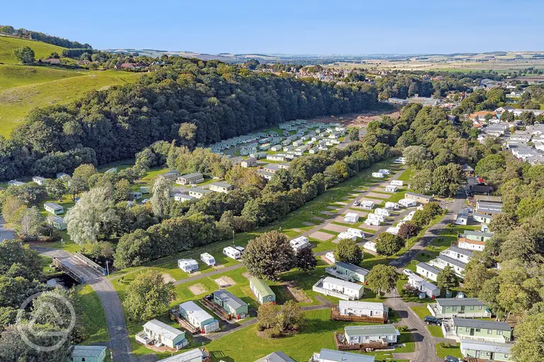 Aerial of Riverside Wooler Holiday Park with hardstanding pitches