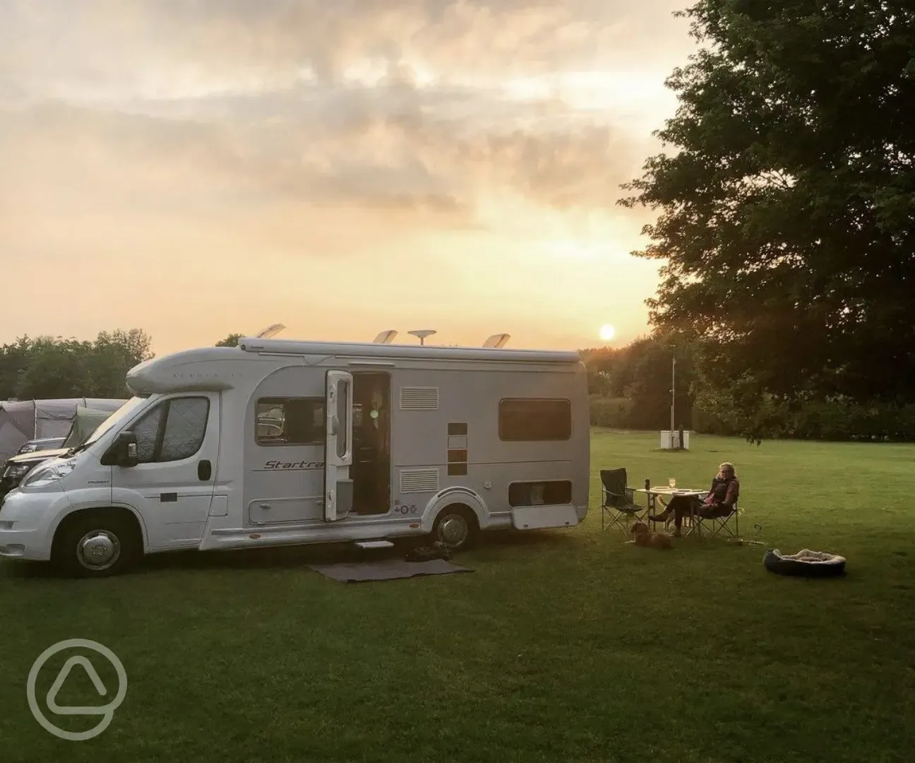Motorhome on hardstanding pitches at sunset