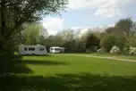 Caravans on electric grass touring pitches with awning space