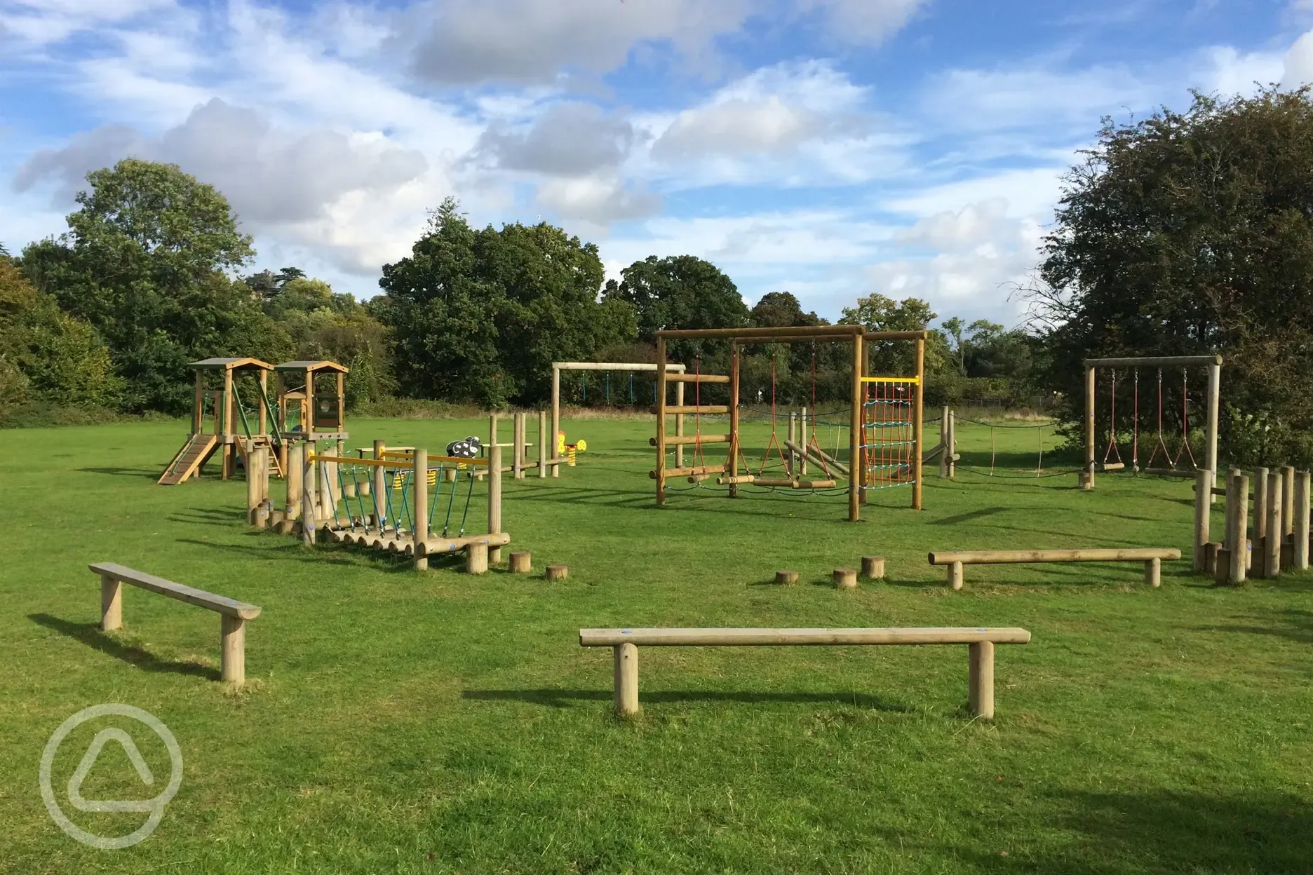 Children's playground at Hurley Riverside Park with swings and climbing frames