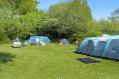 Large tents on a non electric grass pitches (8m x 9m)