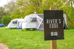 Electric grass touring caravan pitch with a 16 amp electric hook up