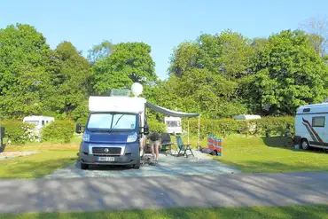 Electric gravel touring pitch with space for an awning at The Green Caravan Park