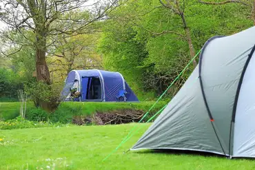 Large tents on a non electric grass pitch (8m x 9m)