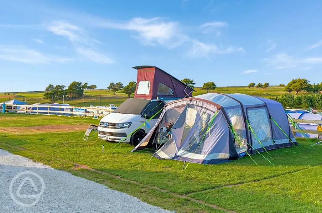 Super grass pitches with electric, grey waste, a water point and TV connection
