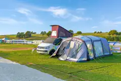 Super grass pitches with electric, grey waste, a water point and TV connection