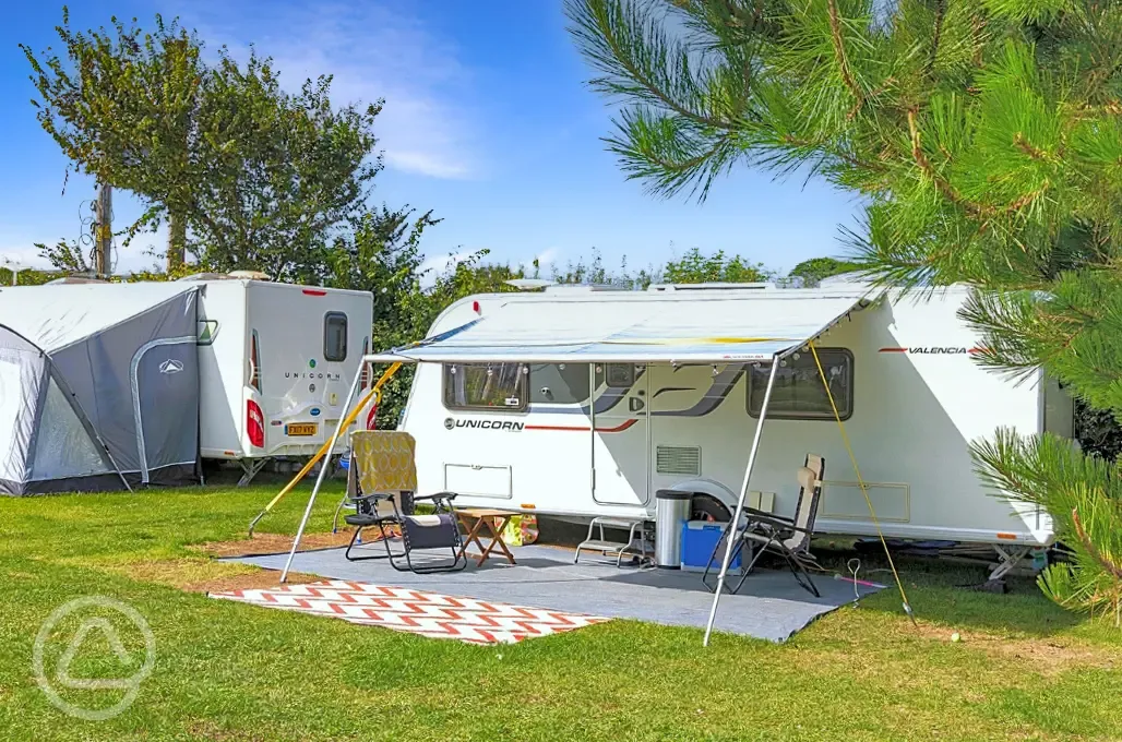 Grass pitches with space for an awning