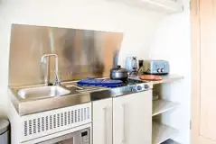 Superior pod kitchen with a microwave, hob, fridge/freezer, kettle and toaster Superior pod kitchen with a microwave, hob, fridge/freezer, kettle and toaster