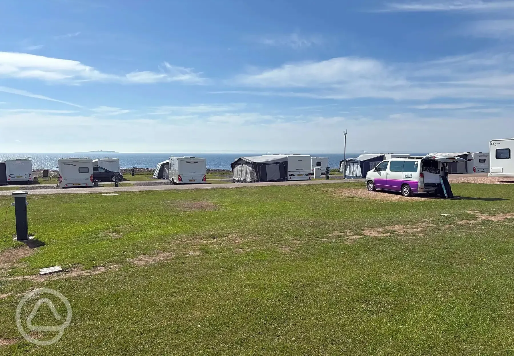 Electric grass touring pitches with sea views
