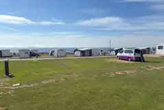 Electric grass touring pitches with sea views Electric grass touring pitches with sea views