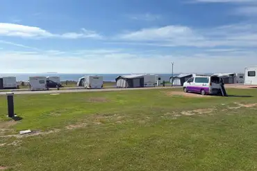 Electric grass touring pitches with sea views