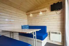 Standard beach hut dining area and TV (bring own crockery and utensils) Standard beach hut dining area and TV (bring own crockery and utensils)