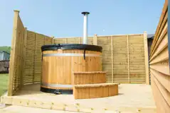 Superior ensuite glamping pod with wood-fired hot tub Superior ensuite glamping pod with wood-fired hot tub