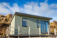Standard beach hut with an outdoor deck and picnic bench Standard beach hut with an outdoor deck and picnic bench