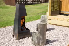 Superior pod with a fire pit area and log seats Superior pod with a fire pit area and log seats