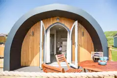 Superior ensuite glamping pod with outdoor seating and glass doors Superior ensuite glamping pod with outdoor seating and glass doors