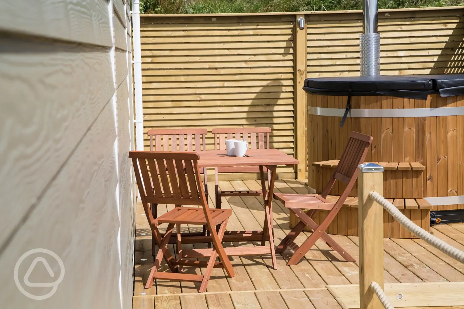 Deluxe ensuite beach hut outdoor seating and hot tub