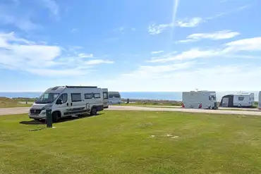Electric grass touring pitches with sea views