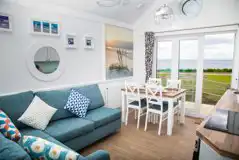 Deluxe beach hut with a double sofa bed and dining area Deluxe beach hut with a double sofa bed and dining area