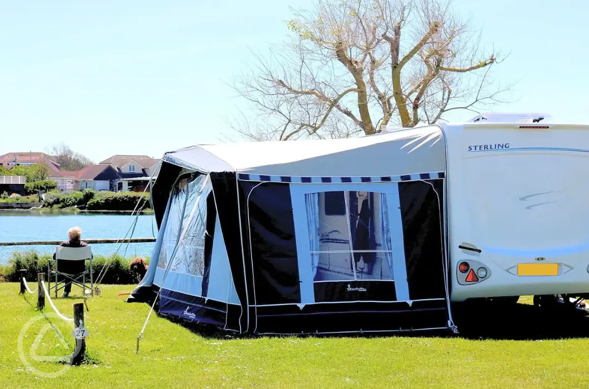 Grass pitches by the water