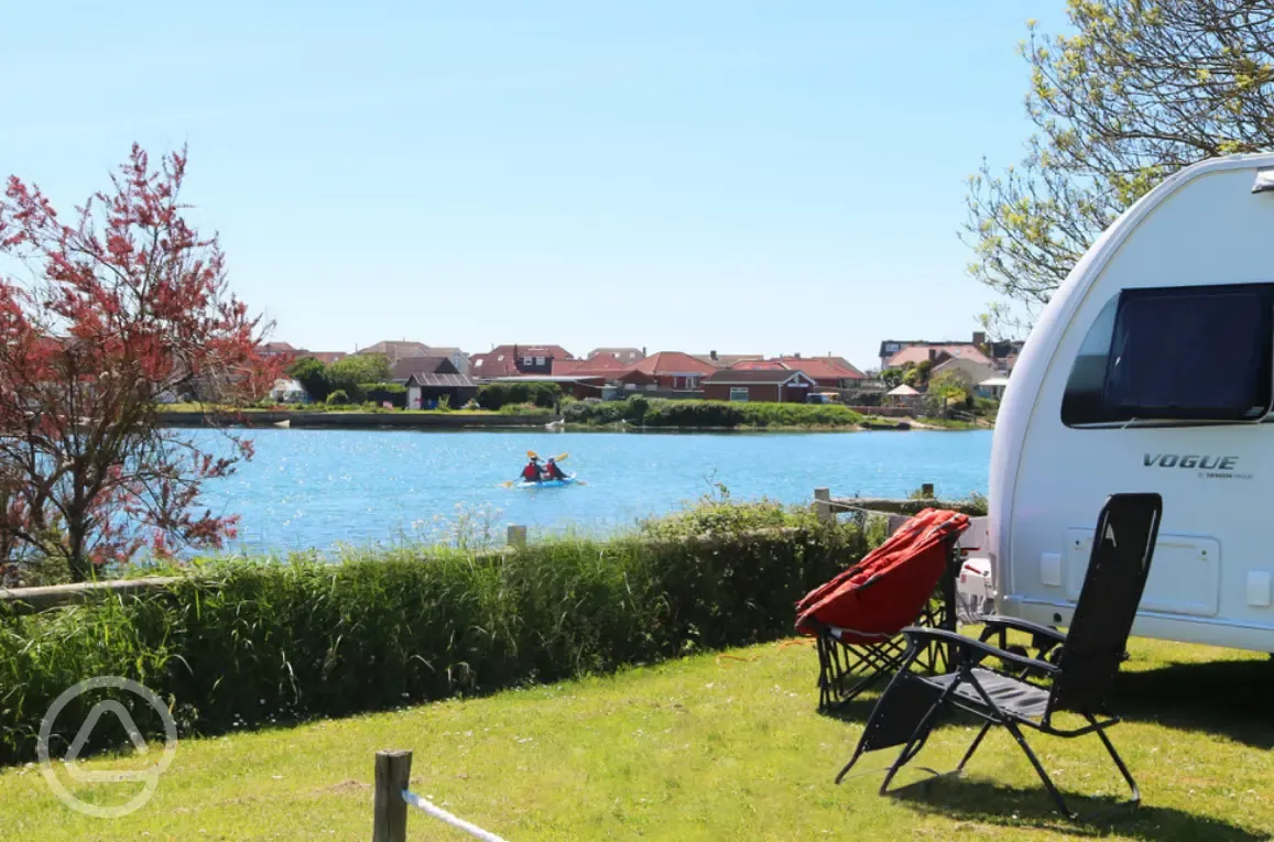 Grass pitches by the water