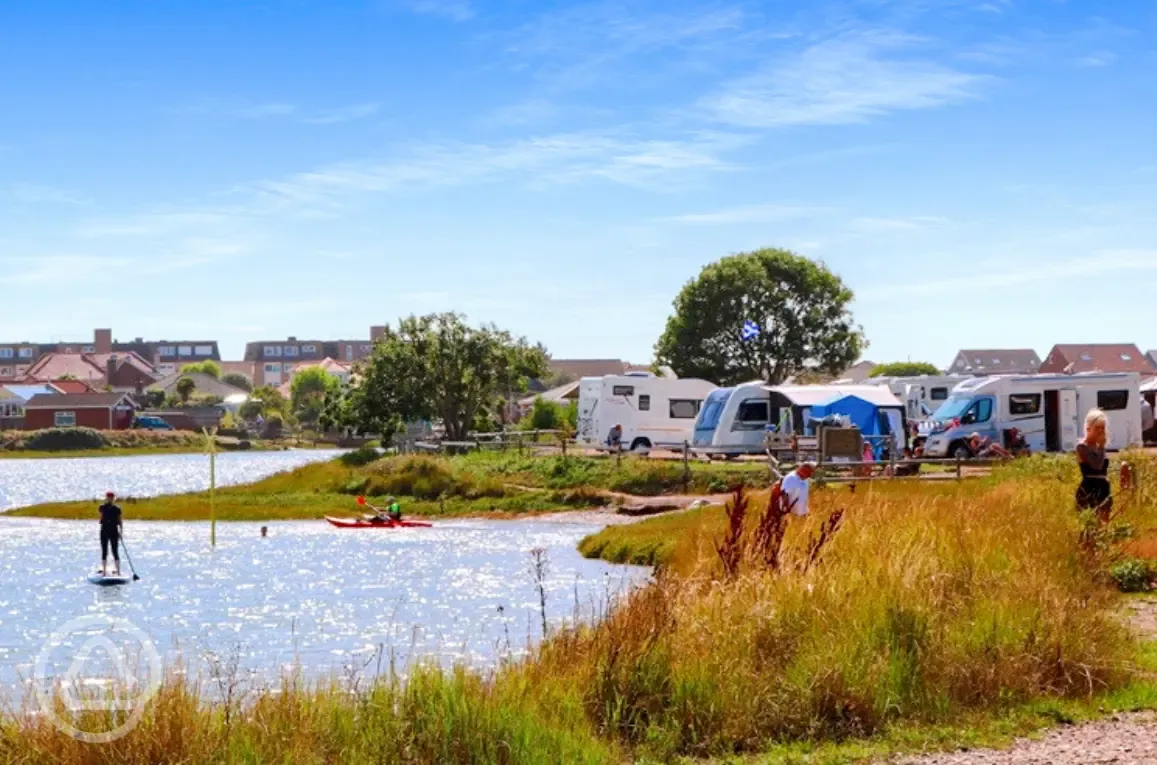 Grass pitches by the water