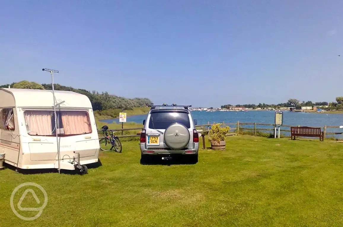 Grass pitches by the water