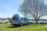 Electric grass pitches overlooking lake