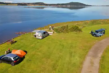 Non electric grass pitches by the waterfront