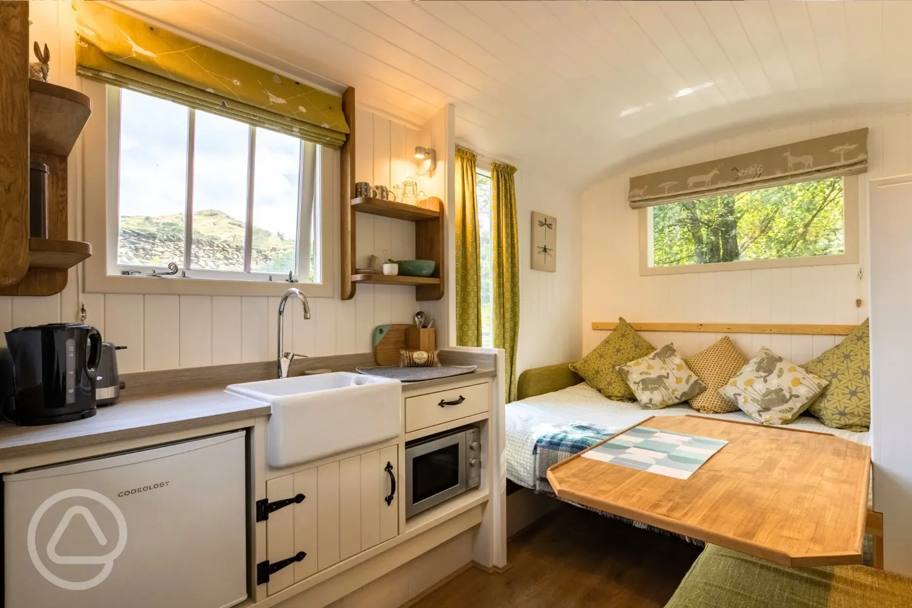 Shepherd's hut interior with a fold-down double bed