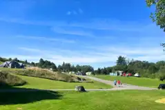 Non electric fellside grass pitches with a central paved road Non electric fellside grass pitches with a central paved road